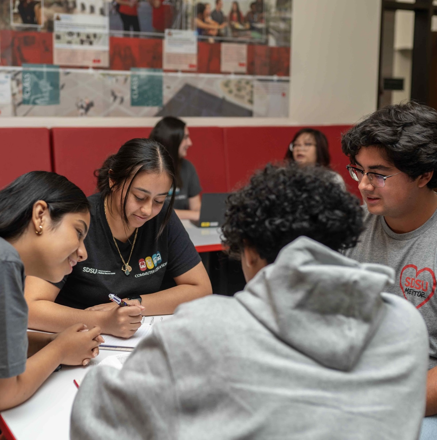 students looking at work