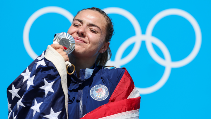 Silver medalist Nevin Harrison of Team United States celebrates on the podium during the Women's Canoe Single 200m medal ceremony after the Women's Canoe Single 200m Final on day fifteen of the Olympic Games Paris 2024 at Vaires-Sur-Marne Nautical Stadium on August 10, 2024 in Paris, France. (Photo by Charles McQuillan/Getty Images)